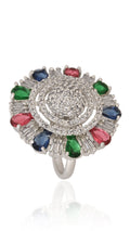 Silver ring with colorful gemstones on a white background